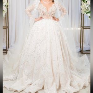 custom-made dress with a crown and veil.